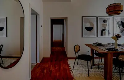 a living room with a table and a mirror at Apartamento Aleyda in Valencia
