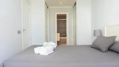 a bedroom with a bed with towels on it at El Coso in Valencia