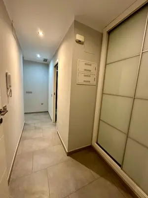 a hallway with a door leading to a room at El Coso in Valencia