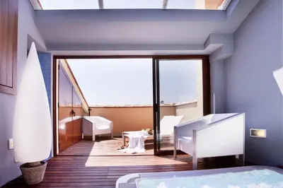 a bedroom with blue walls and a large glass door at El Rincon De Jara in Caudiel