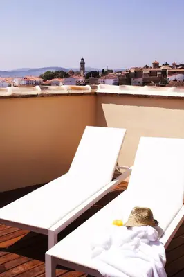 two white chairs on a balcony with a view at El Rincon De Jara in Caudiel