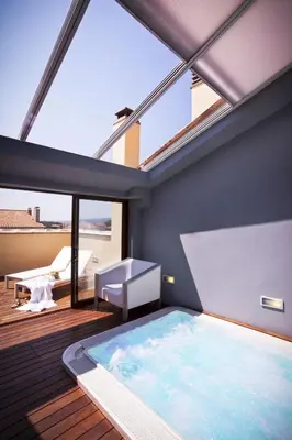 a large swimming pool in a room with a large window at El Rincon De Jara in Caudiel