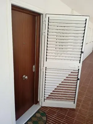 a door leading into a room with a door at Nautic, 4-I in Cullera