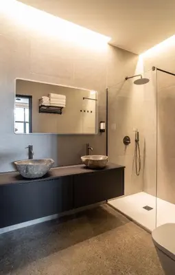 two sinks on a counter in a bathroom with a shower at Central loft 60 m2 ideal for small families in Valencia