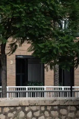 a white fence in front of a building at Central loft 60 m2 ideal for small families in Valencia