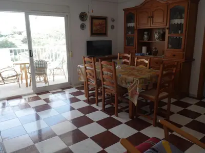 a dining room with a table and chairs at Navarrete, 4-20 in Cullera