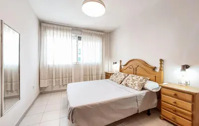 a bedroom with a bed and a dresser and a window at Beautiful Apartment In Canet De Berenguer in Canet de Berenguer