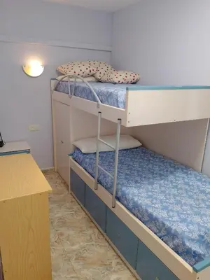 two bunk beds in a room with a desk at Van-Dyck, ESC-4, 6-24 PK 18 in Cullera