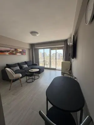a living room with a couch and a table at apartamento con vistas en la playa de San Antonio in Cullera