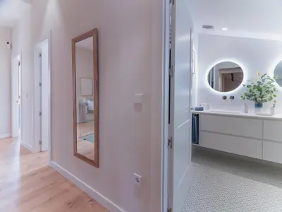 a white bathroom with a mirror and a sink at MD Villa Barraques de Lluna in Valencia