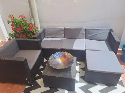 a living room with a couch and a table at Apartamento Rural La Manchega in Villar del Arzobispo