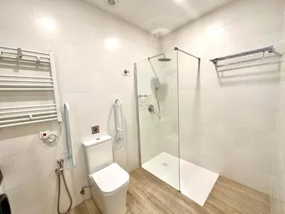 a bathroom with a toilet and a glass shower at Urban Style in Valencia