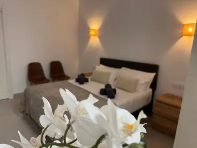 a bedroom with a bed with white flowers at Basset 1 in Valencia