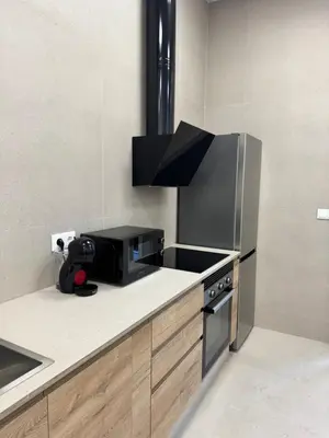 a kitchen with a microwave and a black appliance at Basset 1 in Valencia