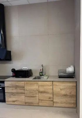 a kitchen counter with a sink and a microwave at Basset 3 in Valencia