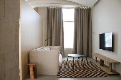 a living room with a couch and a table at BNO studio 1c in Aldaia