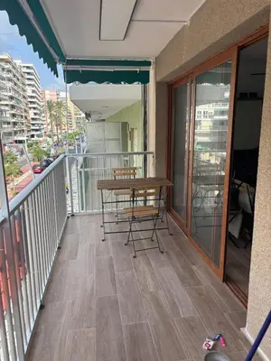 a bedroom with a white bed and a window at Brisa Marina in Cullera