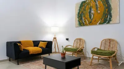 a living room with a couch and two chairs at Across from the Turia Modern City Stay in Valencia