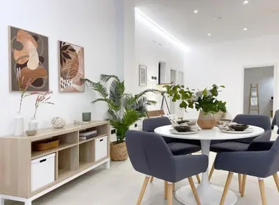 a white living room with a table and chairs at Sunny Stay Valencia 4 pax wifi in Valencia