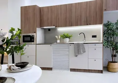 a white kitchen with a sink and a table at Sunny Stay Valencia 4 pax wifi in Valencia