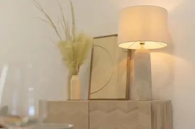 a table with a lamp and a mirror on it at Dorm4You Calle Gibraltar 15 Ruzafa Apartments in Valencia