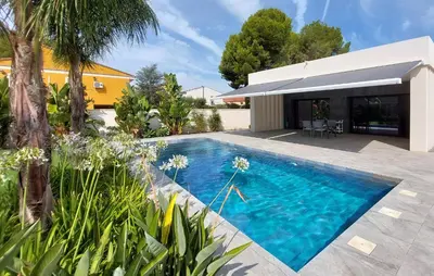 a swimming pool in the backyard of a house at Amazing Home In Serra in Serra