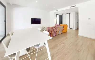 a white living room with a white table and a couch at Amazing Home In Serra in Serra