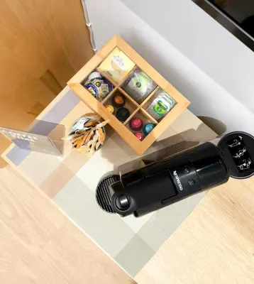a table with a bottle of wine next to at The Sunshine Apartment in Valencia