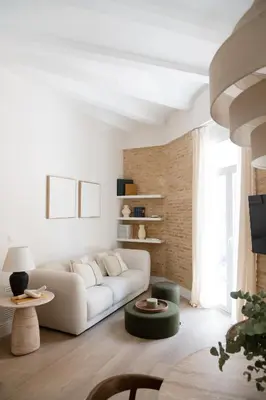 a white living room with a couch and a table at Valencia Boutique Stays - High End Apartment in Ruzafa for long stays in Valencia