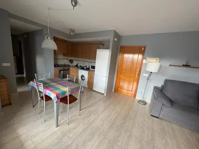 a kitchen with a table and chairs in a room at Raquel Host Moncofar in Moncófar