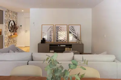 a living room with a couch and a table at VLC Host - Belgica Apartments in Valencia