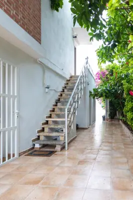 a staircase leading up to a building with plants at Casa La Mar in Mareny Blau