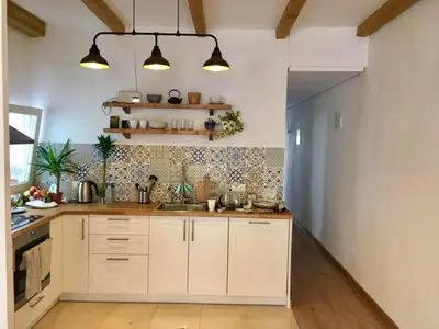 a kitchen with white cabinets and a sink at Private Room in Central Valencia in Valencia