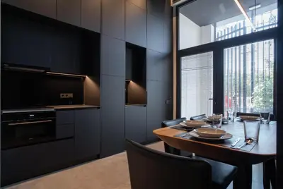 a dining room with a table and a large window at Crudo un Loft centrico de 50 m2 in Valencia