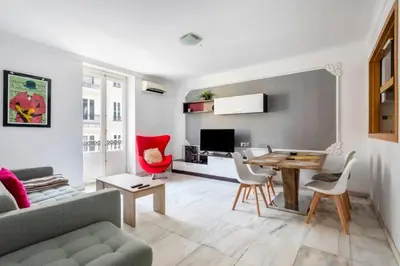 a living room with a couch and a table and chairs at Super Flat 3 rooms 1 toilet Center wifi AC in Valencia