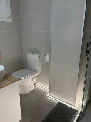 a bathroom with a sink and a toilet at Vista al mar con piscina in Faro de Cullera