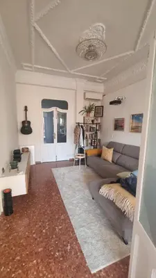 a living room with a couch and a table at Modern Flat with Large Terrace in Valencia