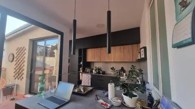 a kitchen with a laptop computer on a table at Modern Flat with Large Terrace in Valencia