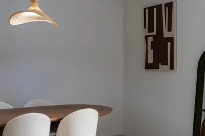 a dining room table with white chairs and a lamp at VLC HOST - Linterna in Valencia