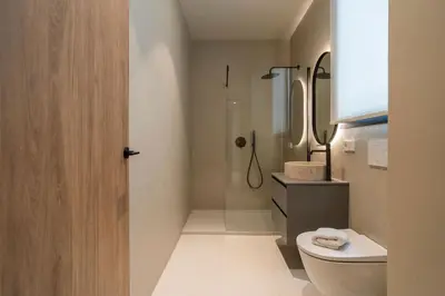 a bathroom with a shower and a toilet and a sink at VLC Host - Martí Apartments in Valencia