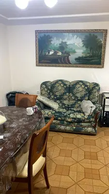 a living room with a couch and a table at Apartamento en Cullera playa con amplio balcón in Cullera
