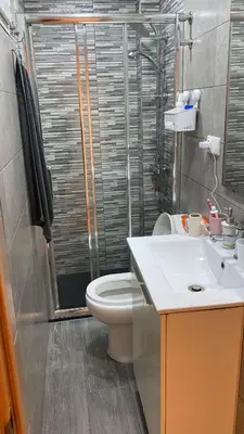 a bathroom with a toilet and a sink at Apartamento en Cullera playa con amplio balcón in Cullera