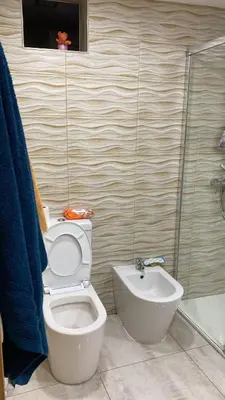 a bathroom with a toilet and a sink at Apartamento en Cullera playa con amplio balcón in Cullera