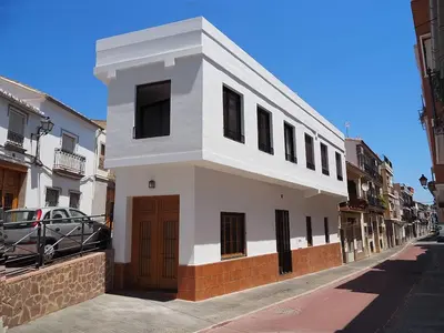 a white building on the side of a street at Apartamentos SAN JOSÉ in El Puig