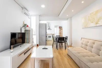 a living room with a couch and a table at GuestReady - Comfort in Valencia in Valencia