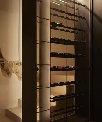 a glass wine cellar with shoes on a shelf at Enoa Casa Cueva in Requena