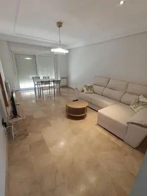 a living room with a couch and a table at First Floor Casa Privee - Two bed Beach Terrace & Balconies in Puerto de Sagunto