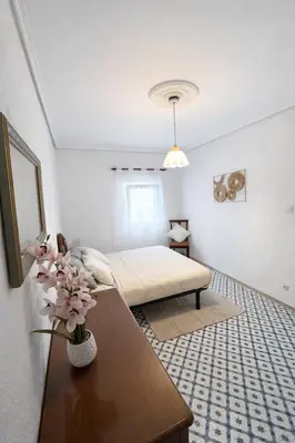 a bathroom with a tub and a washing machine at Cullera Center, 15 min Beach in Cullera