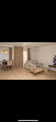 a living room with a couch and chairs and a table at Habitación luminosa en piso compartido in Valencia