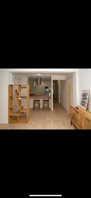 a living room with a table and a desk at Habitación El Cabanyal in Valencia